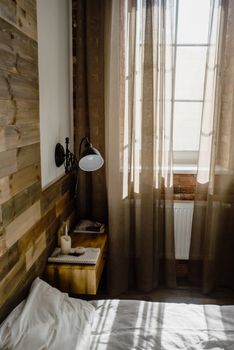 Inviting minimalist bedroom with soft lighting and a rustic wooden design.