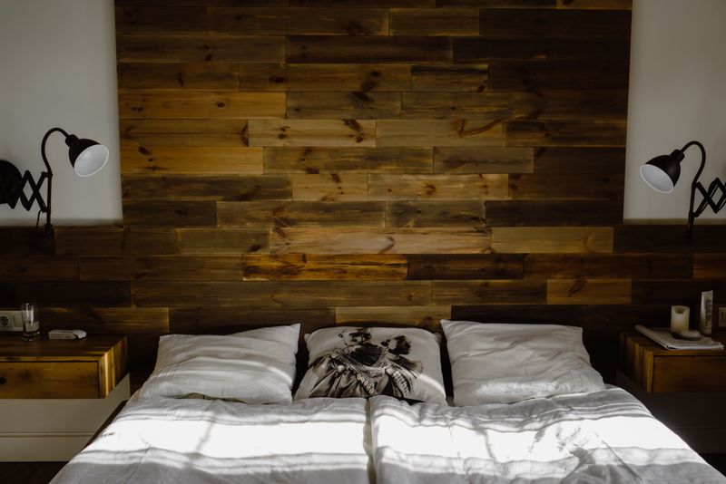 Upholstered wooden headboard in a bedroom