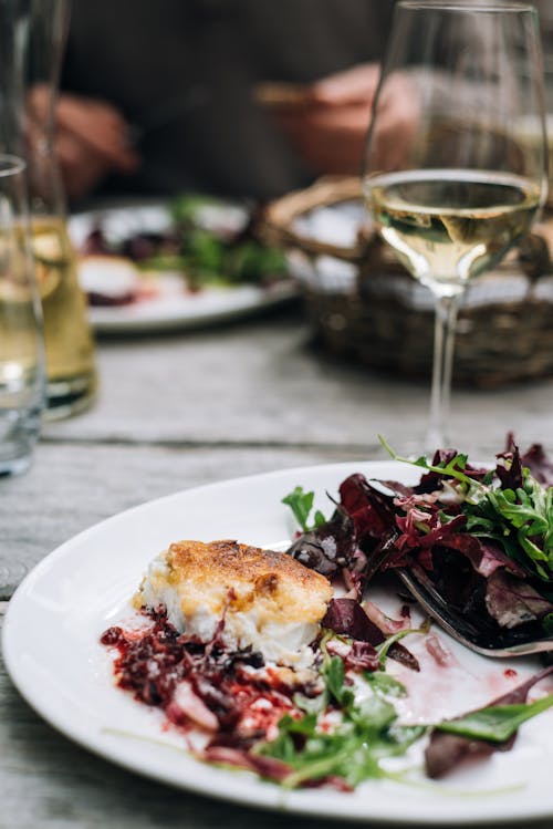 Free Served table with wine and meal Stock Photo