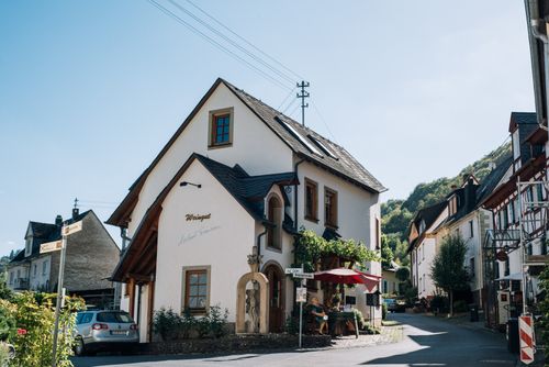 Free Exterior of classic residential houses with narrow asphalt road and parked automobile in highland Stock Photo