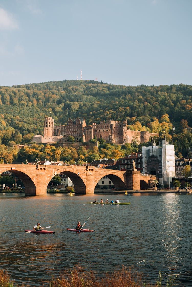 Old Bridge Over River With Canoe