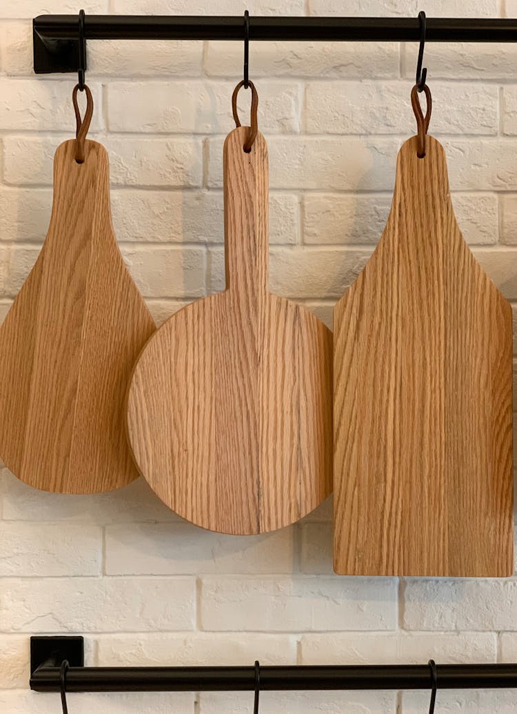 Decorative Wooden Cutting Boards Hanging In Kitchen