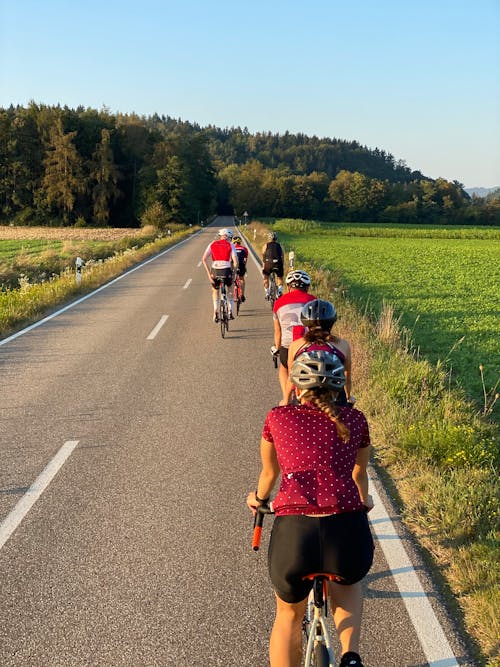 People Riding Bicycle on the Road