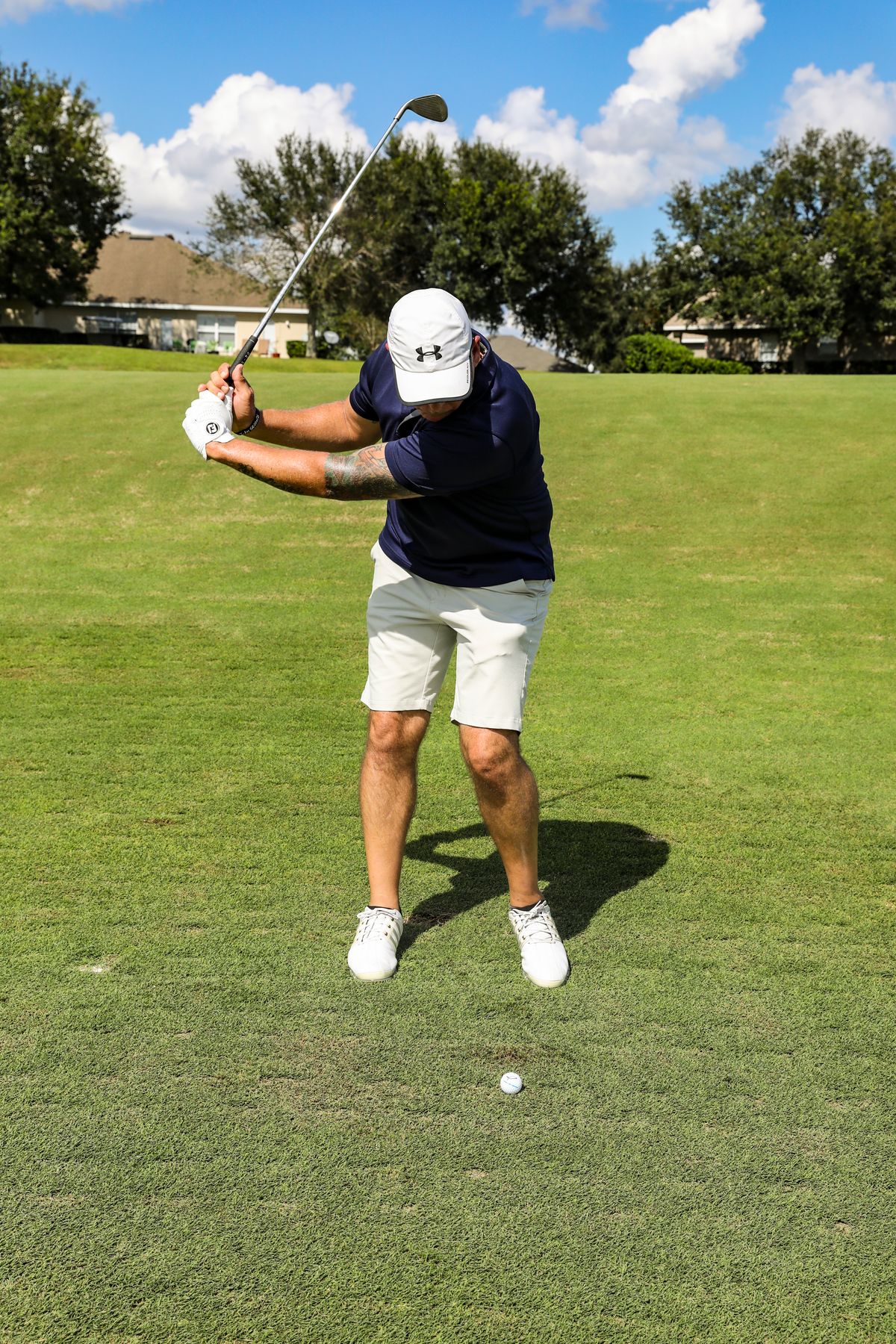 Golfer swinging a golf club