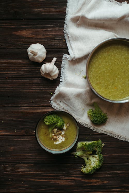 broccoli and garlic next to green soup