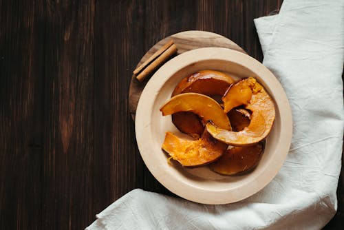 Sliced Pumpkin on Round Wooden Plate