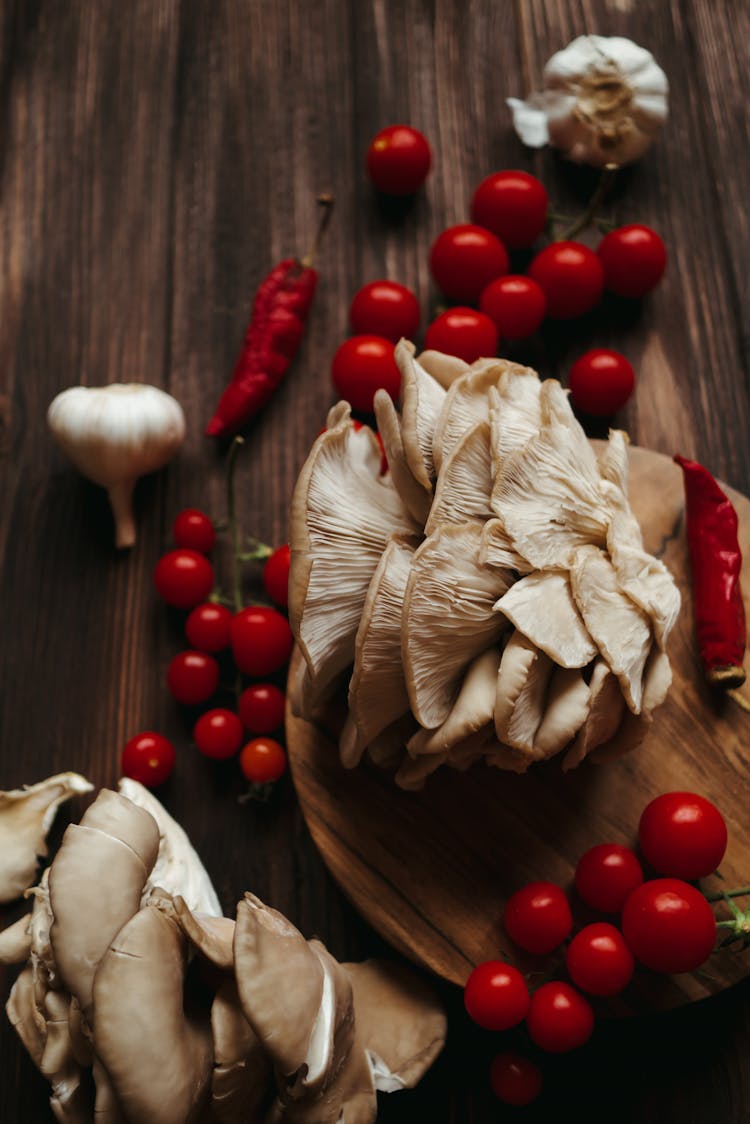 Oyster Mushrooms Surrounded By Cherry Tomatoes