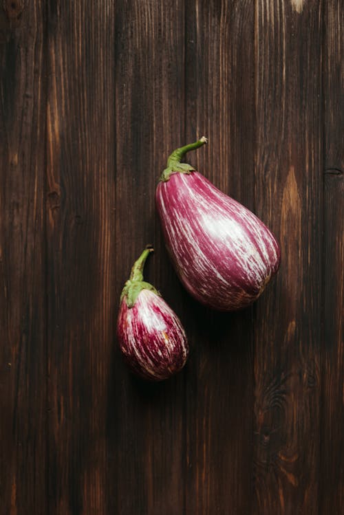 Free Eggplants on Wooden Surface Stock Photo
