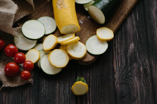 Free Sliced Vegetables on a Wooden Chopping Board Stock Photo