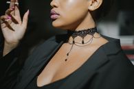 Woman in Black V Neck Top Wearing Silver Necklace