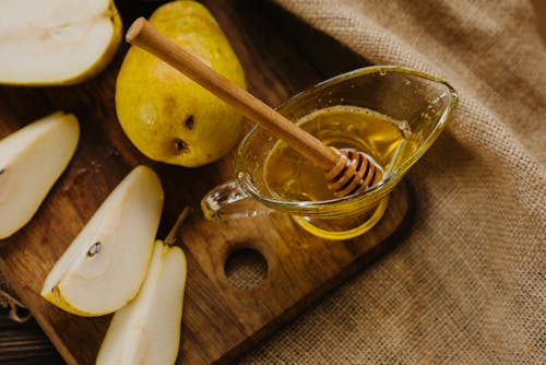 Free Honey with Pears on Cutting Board Stock Photo