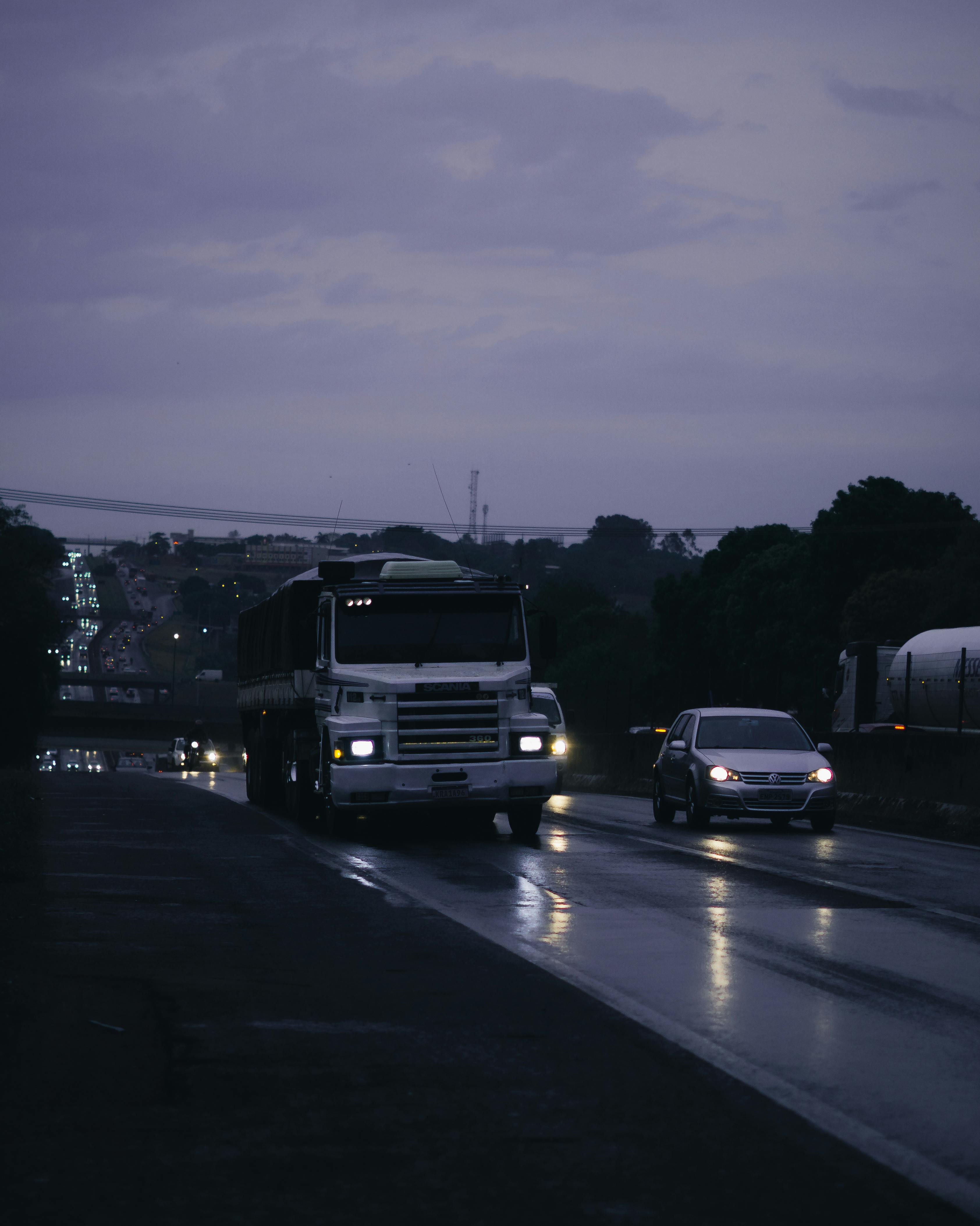 Cars Parked on Parking Lot during Night Time · Free Stock Photo