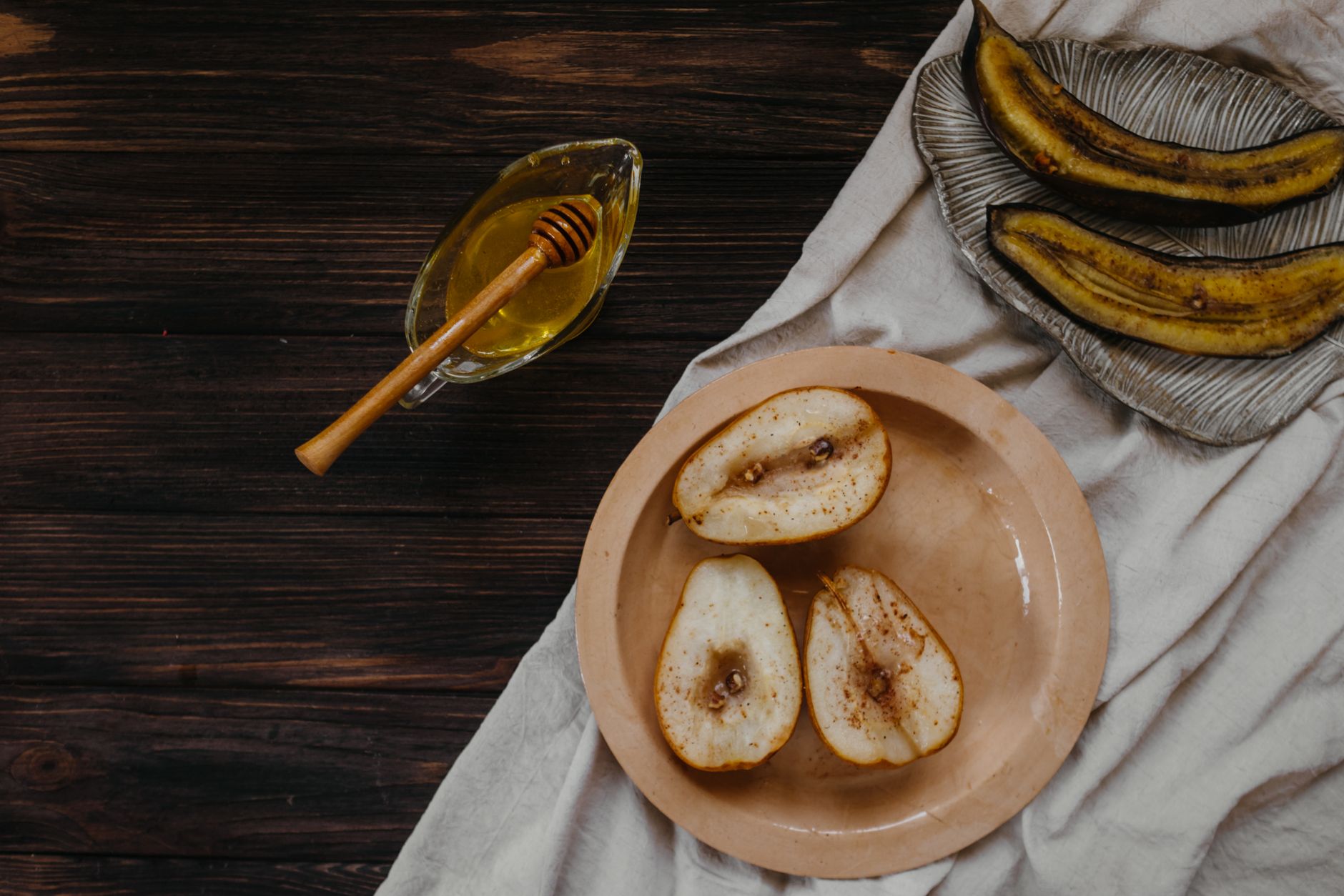 Grilled pears with caramel glaze on ice cream
