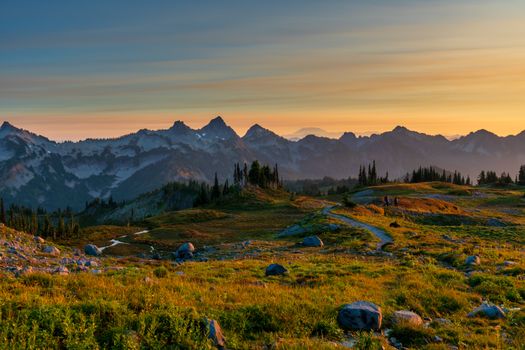 Breathtaking sunset over Cascade Mountains in Ashford, WA. Vibrant landscape with autumn hues.
