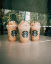 Set of delicious iced coffees with whipped cream to go