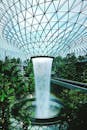 Water Falls From Metal Framed Glass Dome Building