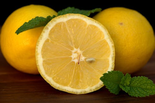 Yellow Lemon Fruit on Brown Wooden Table