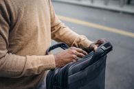 Crop black man with briefcase