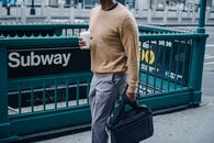 Crop black man walking near subway