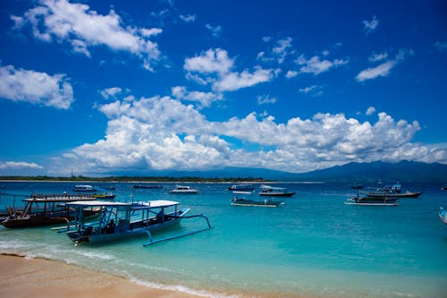 Fishing Boats in the Calm Sea Under Beautiful Blue Sky