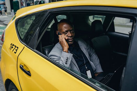 A confident businessman in a taxi making a phone call, conveying professionalism and connection.