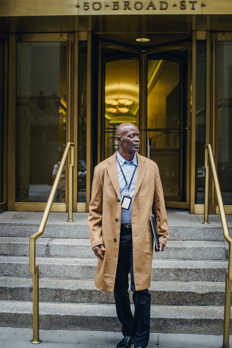 Black Man In Formal Outfit Leaving Hotel