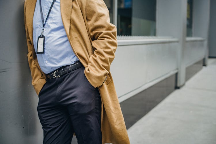 Man With Hands In Pocket Wearing Overcoat