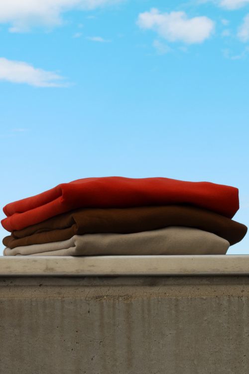 Colorful Stack of Fabric Swatches Isolated · Free Stock Photo