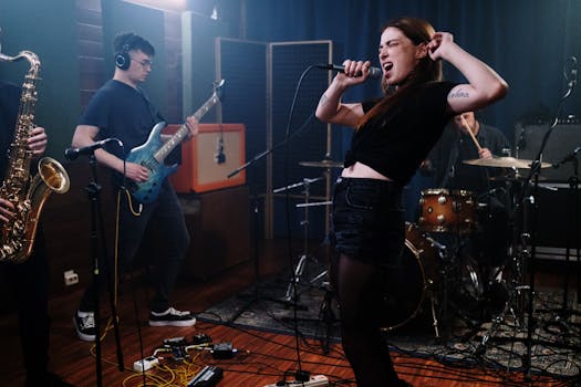 Dynamic performance by a female singer with a band in a recording studio.