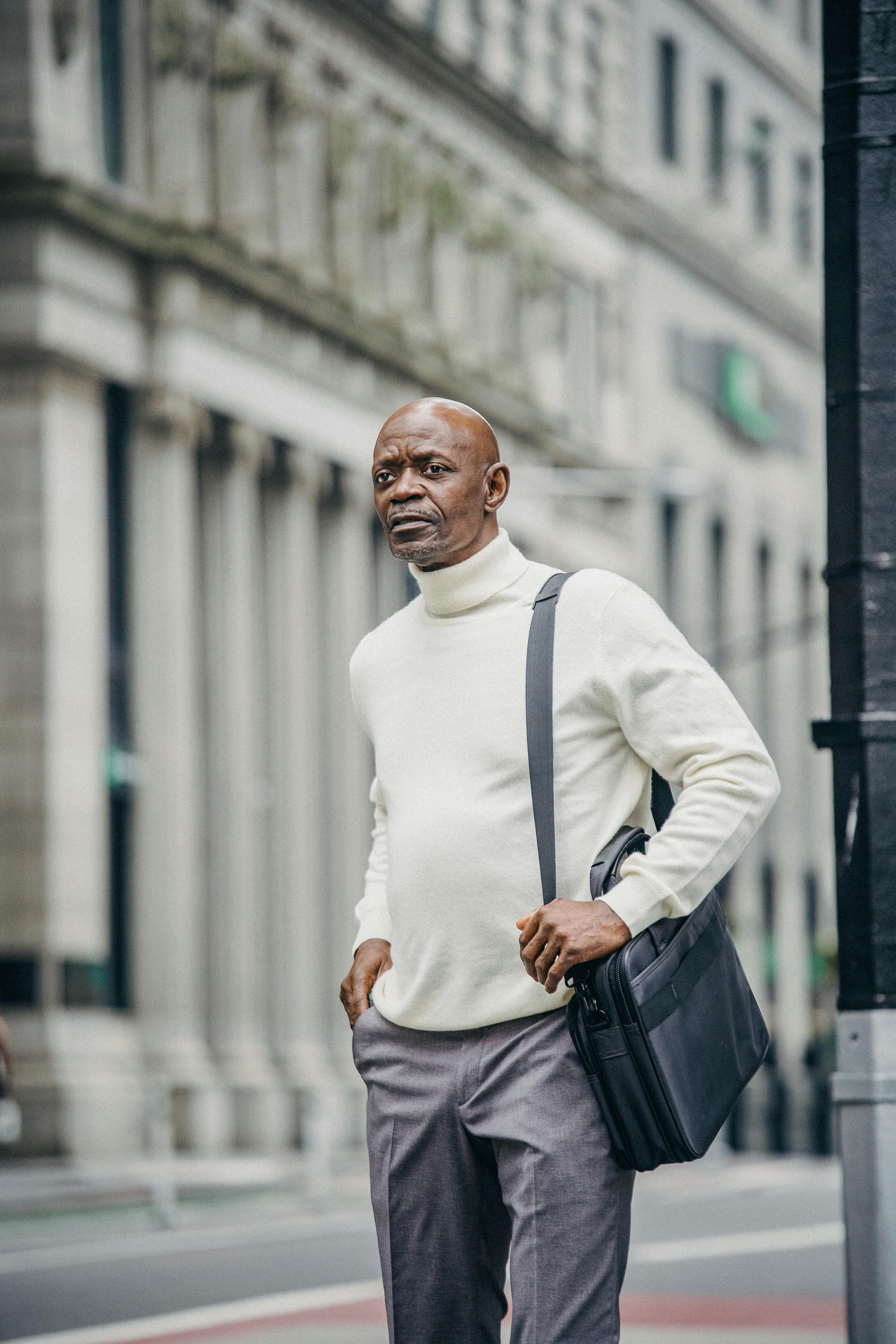 Calm black man standing on roadside in modern city · Free Stock Photo
