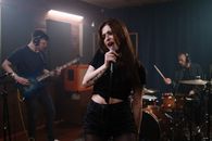 Woman in Black Leather Jacket Singing