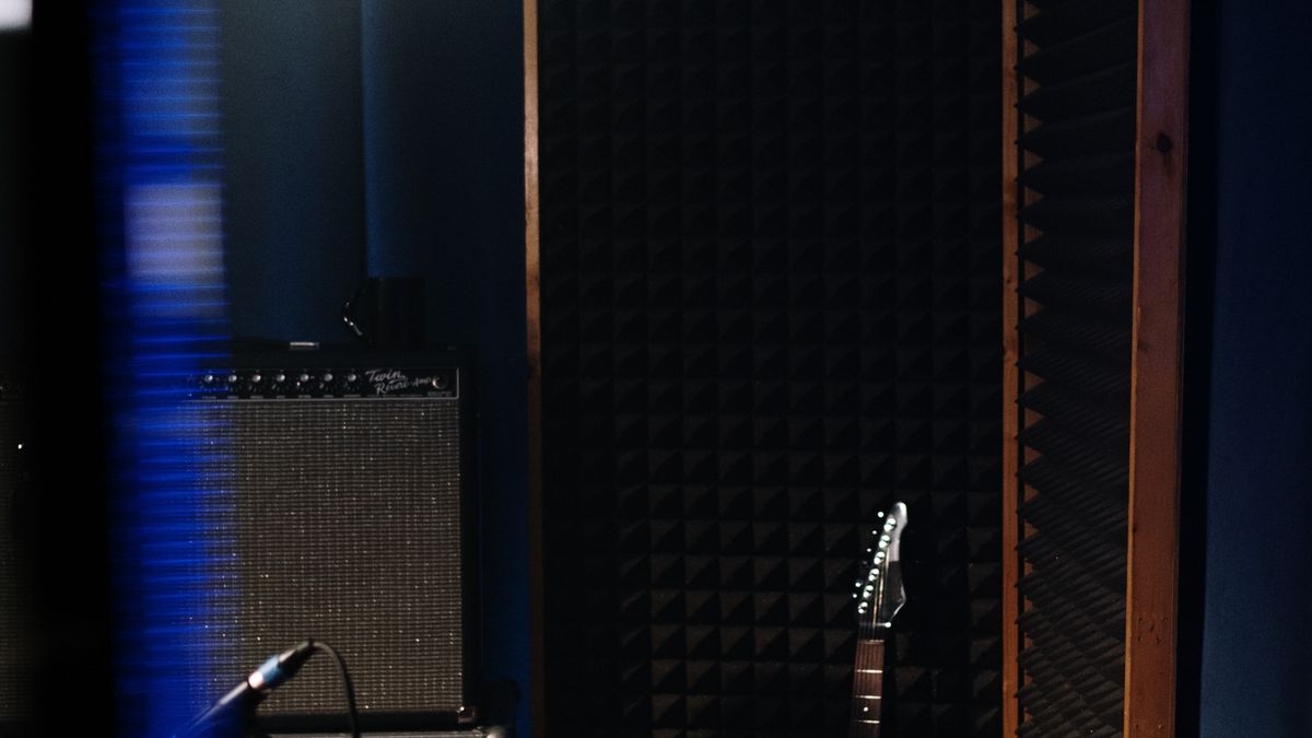 Electric guitar in a recording studio with professional audio equipment
