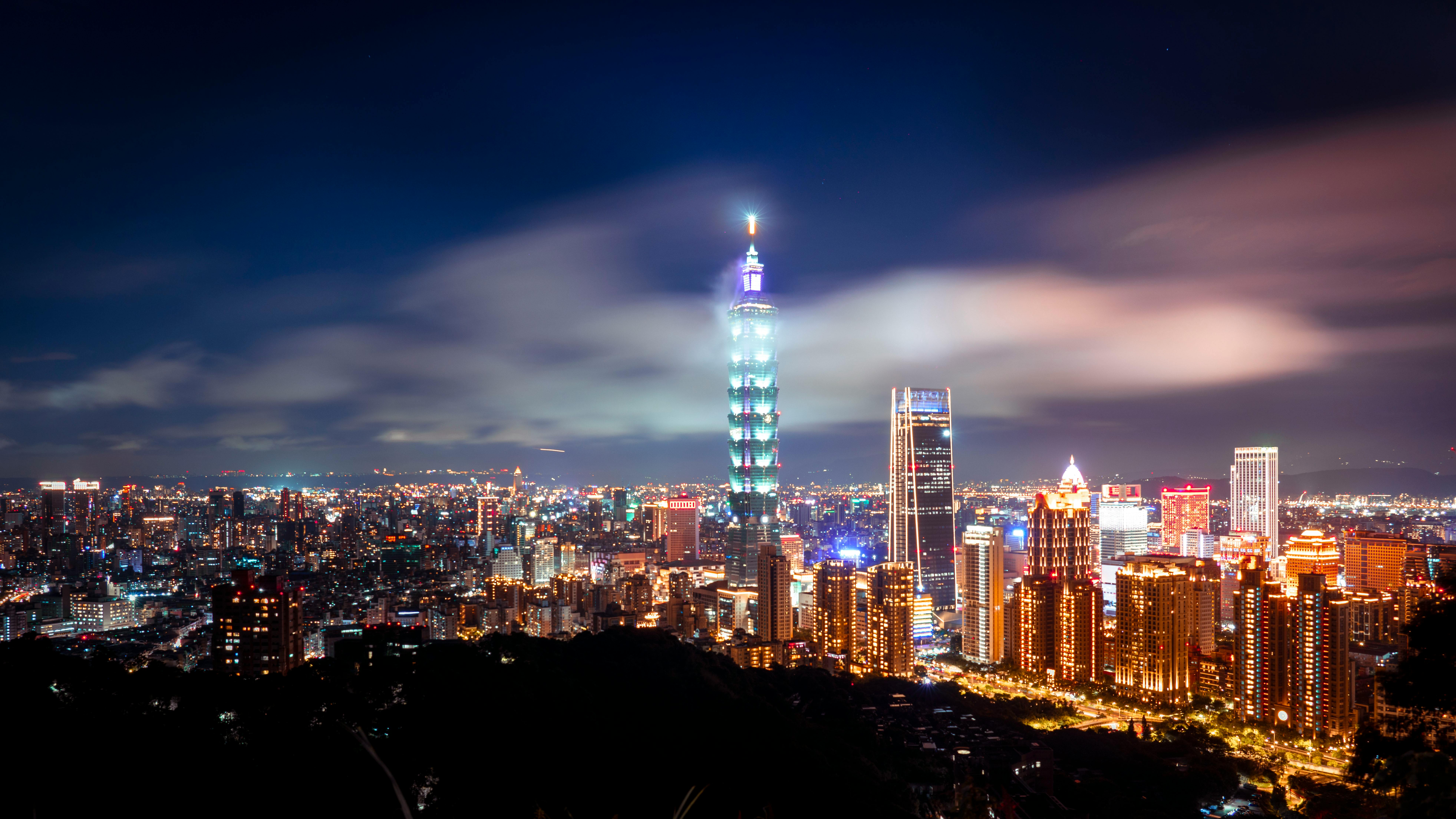 A captivating view of Taipei 101 and city skyline illuminated at night, showcasing urban vibrancy.