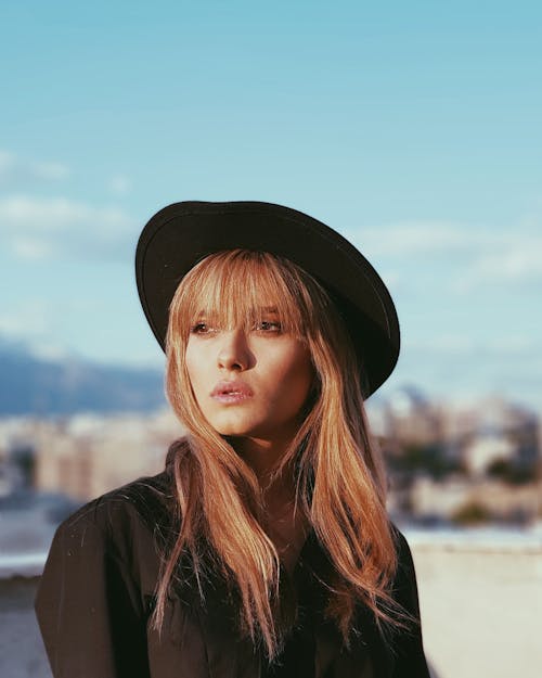 Woman Wearing Black Hat Posing