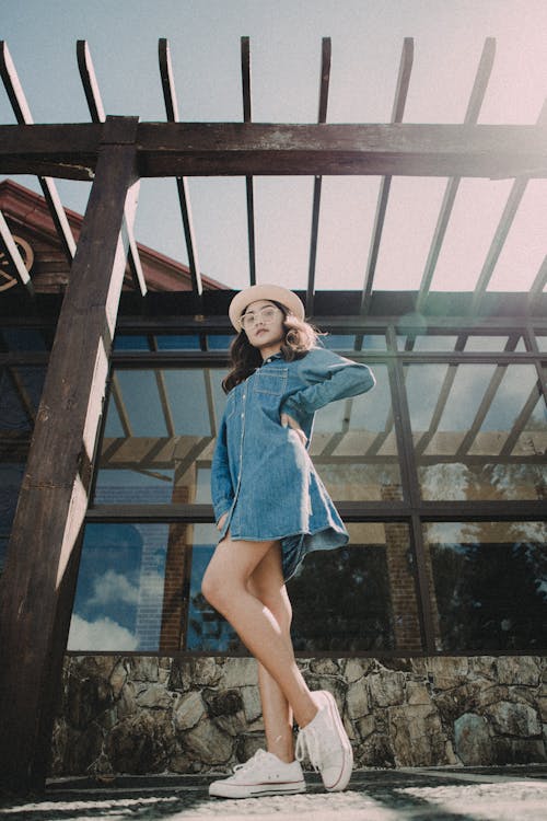 Young Woman in Trendy Look Posing Outdoors