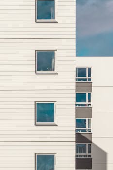 Minimalist apartment exterior with windows in Oslo, Norway. Bright day.