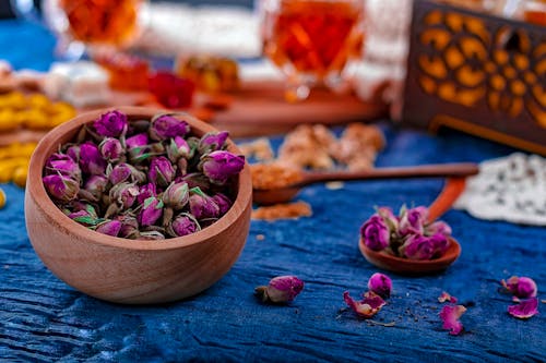 Free Purple and Pink Flower Petals on Brown Wooden Bowl Stock Photo