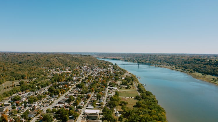 Aerial View Of Remote Coastal Town On River Shore