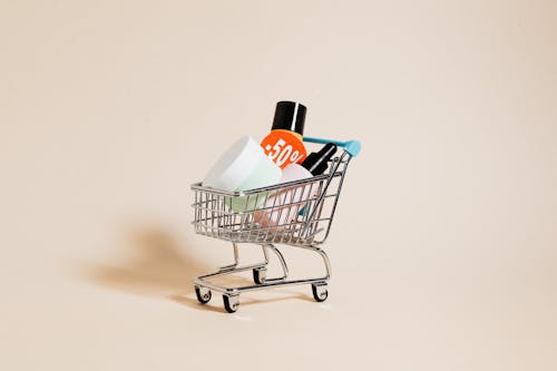 Free Cosmetic Bottles in a Shopping Cart Stock Photo