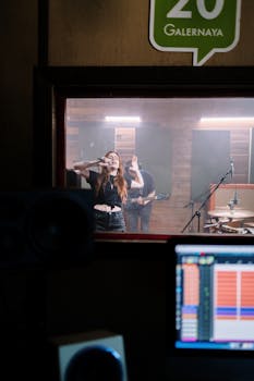 Musicians performing live with recording equipment in a studio, showcasing vibrant energy.