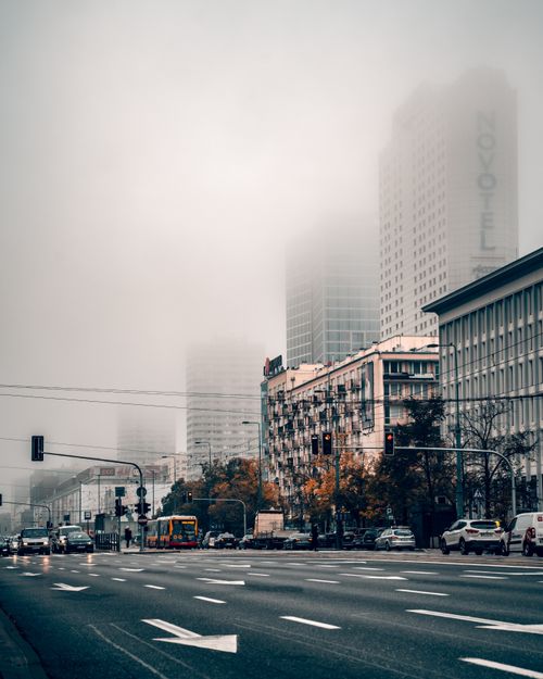 Free A foggy street scene in Warsaw, Poland with traffic and modern buildings. Stock Photo