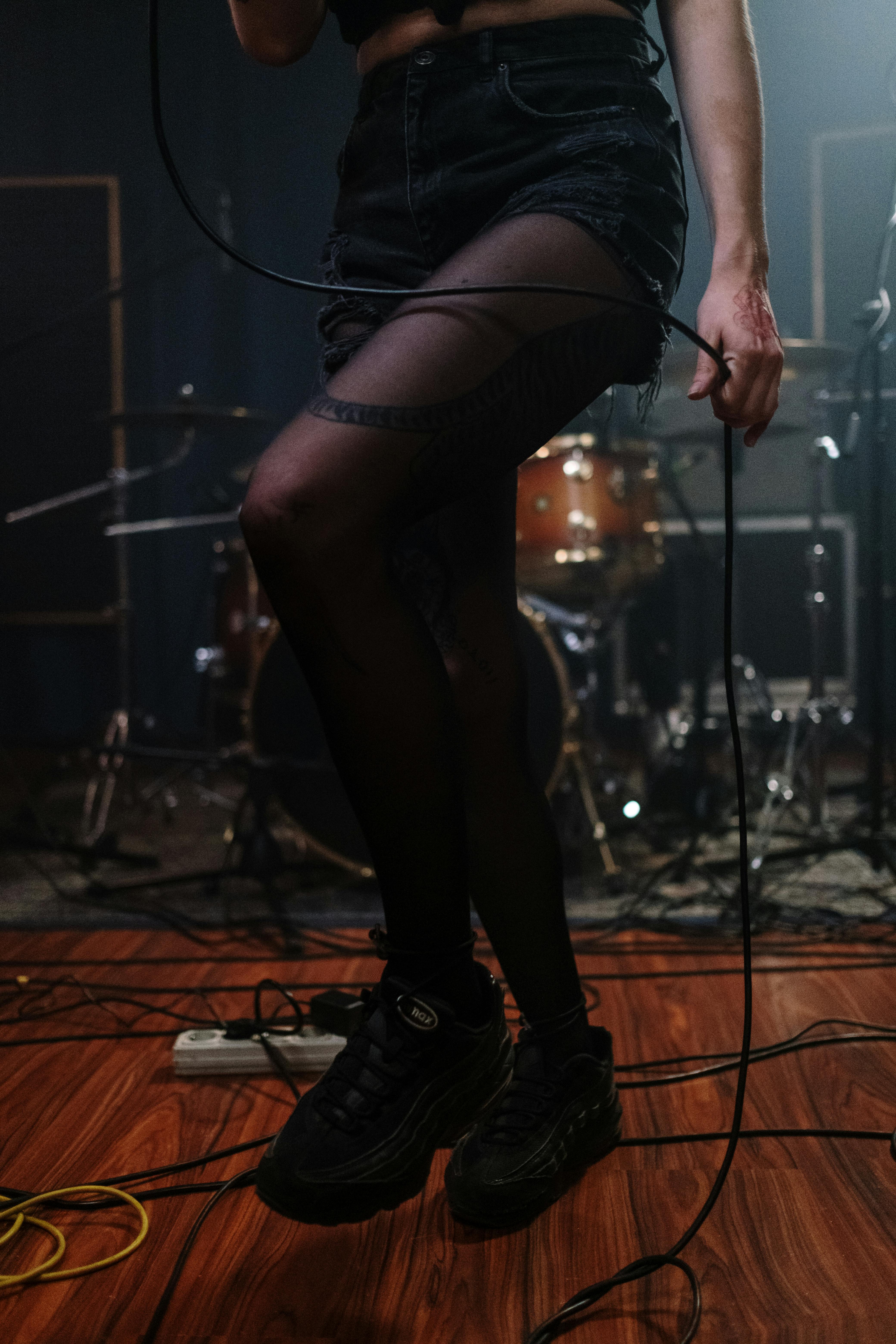 woman in black tank top and black leggings performing on stage