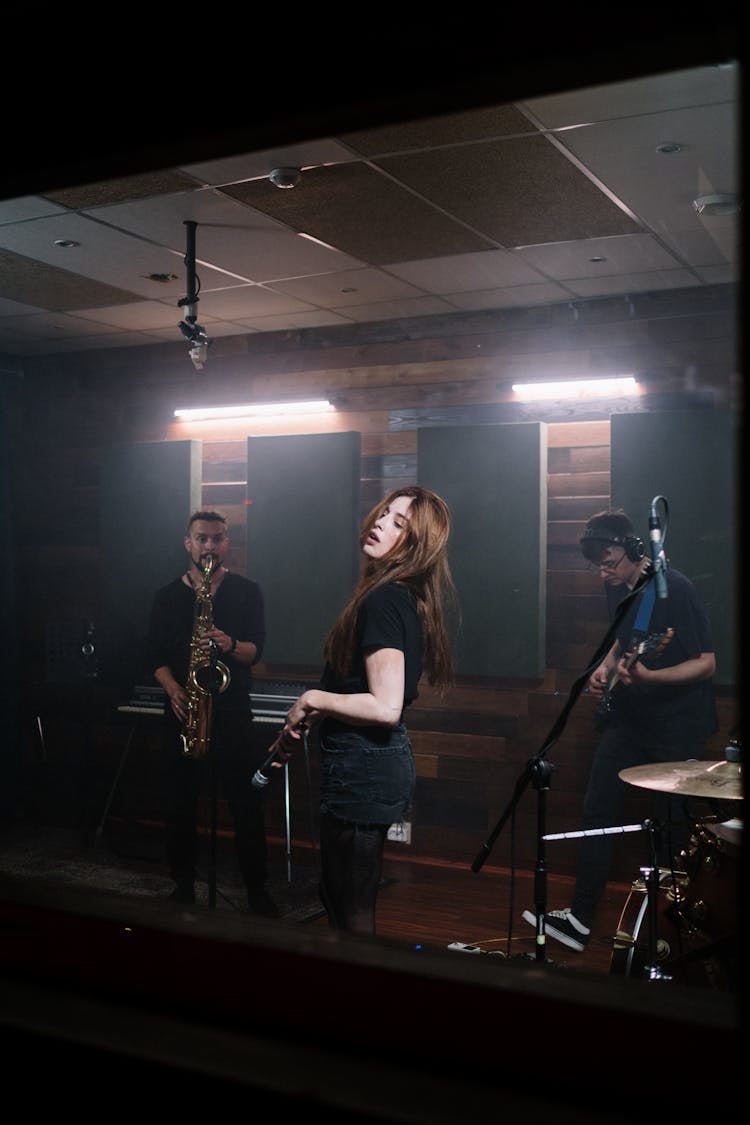 A Woman Performing With Her Band 