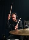 Man in Black Jacket Playing Drums