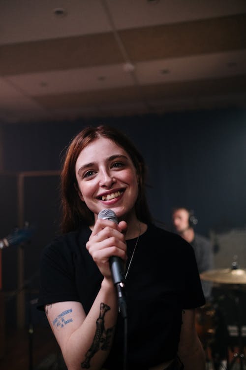 Happy Woman Holding a Microphone