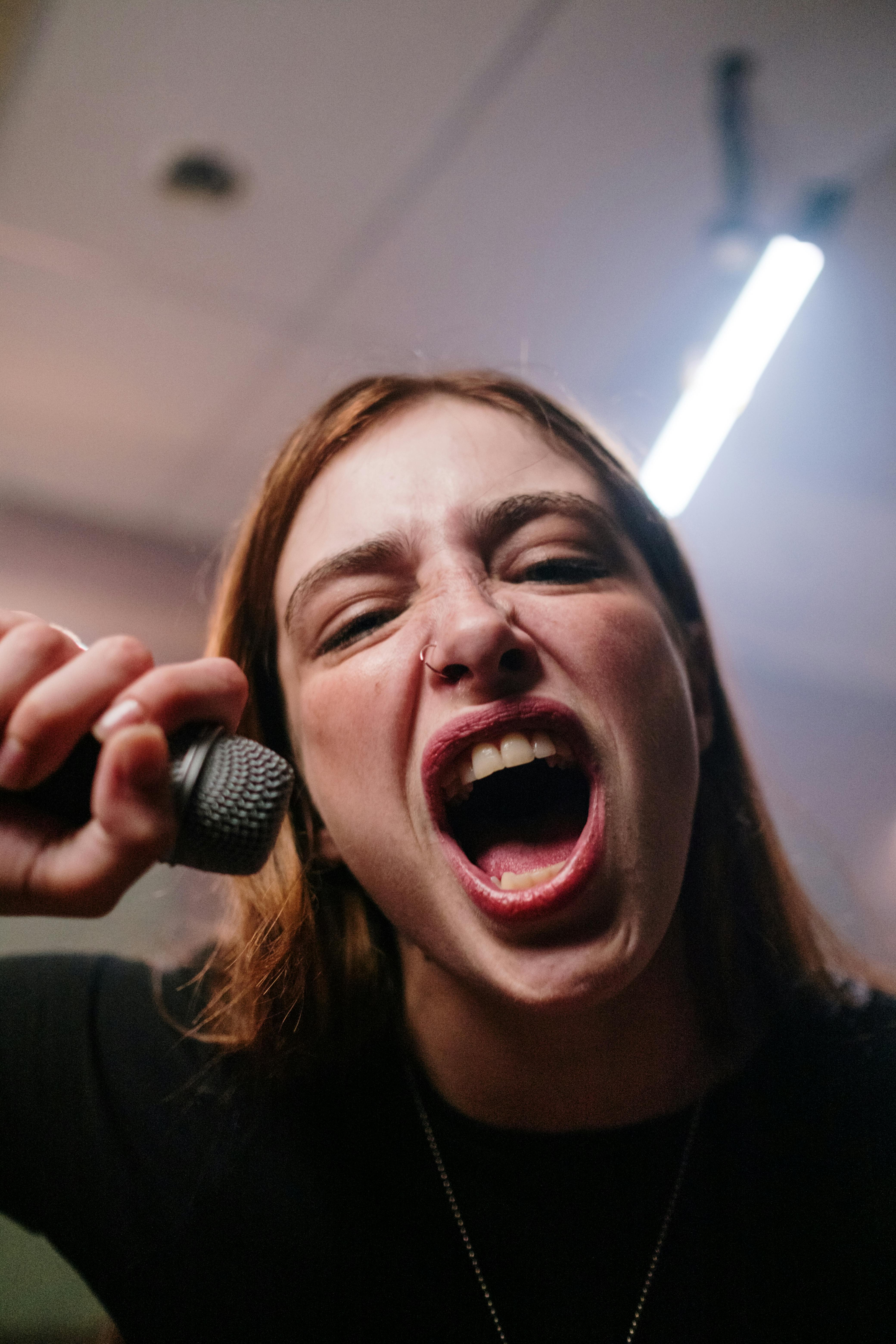 woman holding a microphone