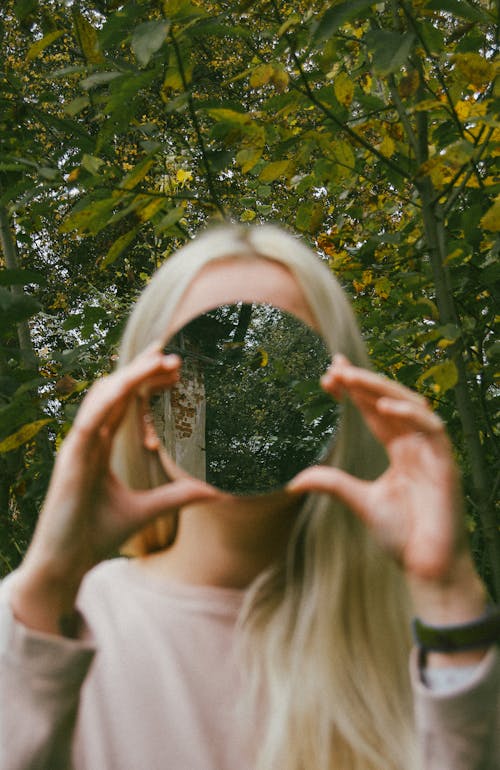 Blonde against Deciduous Trees