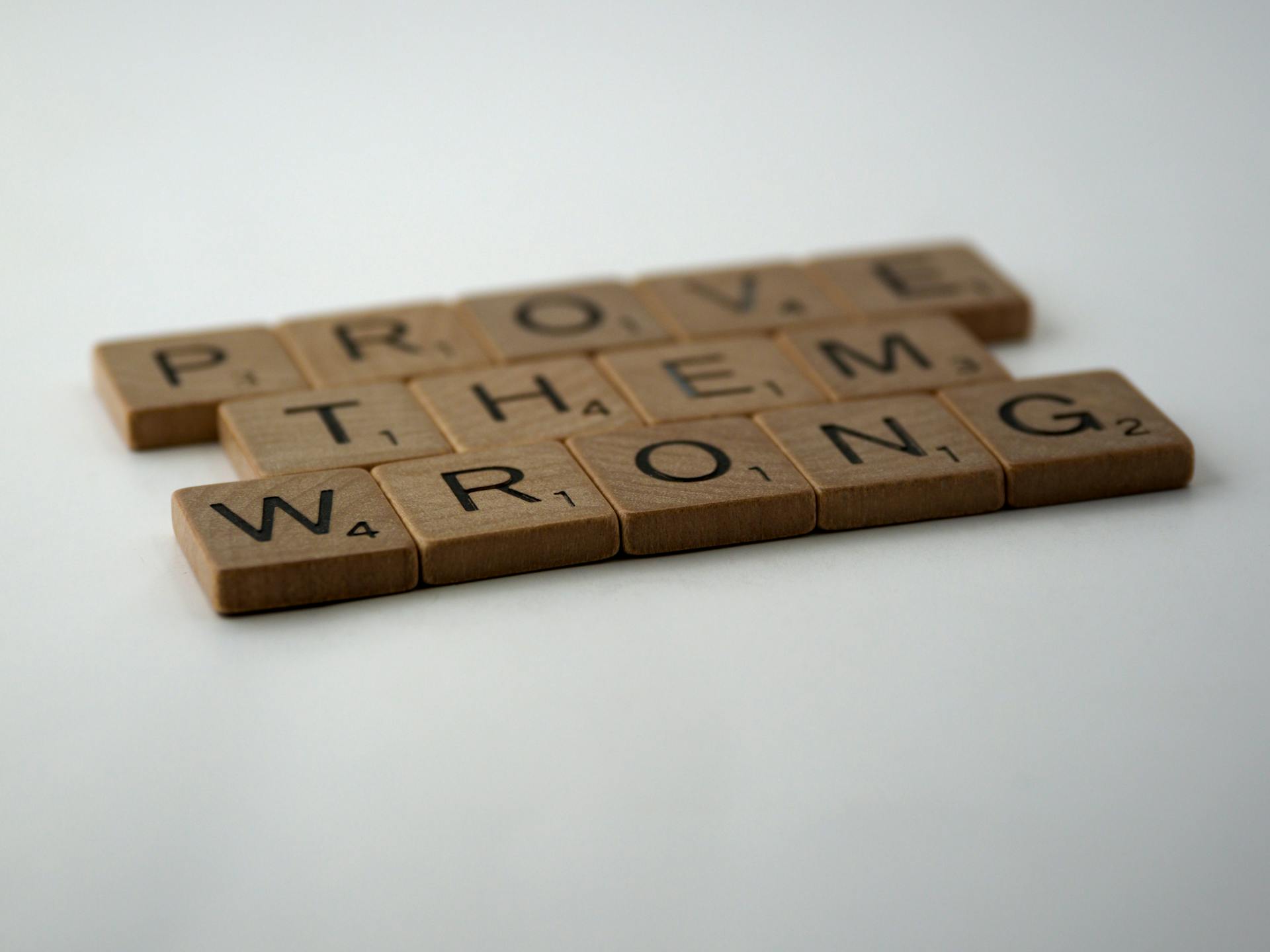 Wooden Scrabble Tiles on White Surface