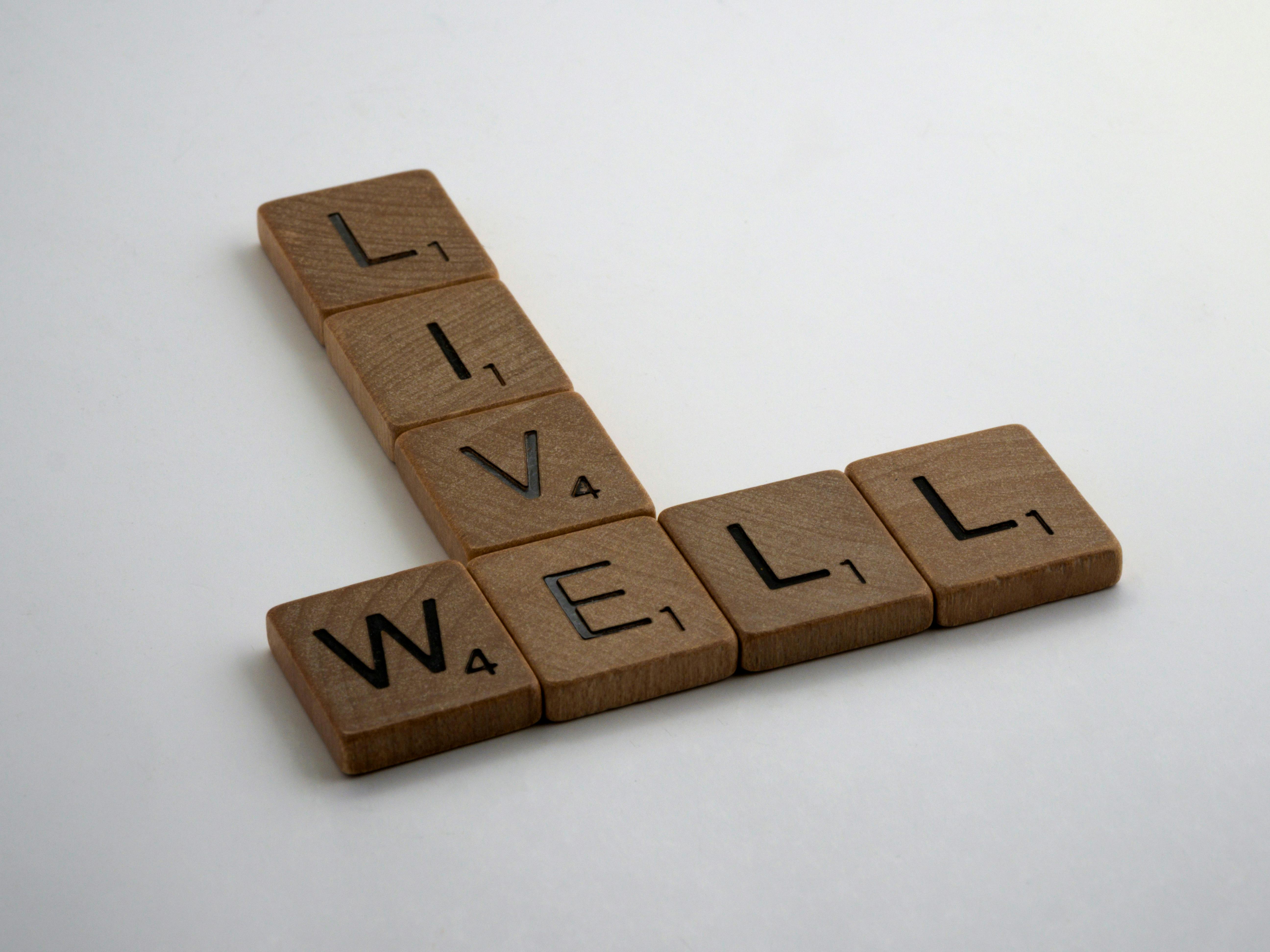 wooden brown letter tiles on white surface