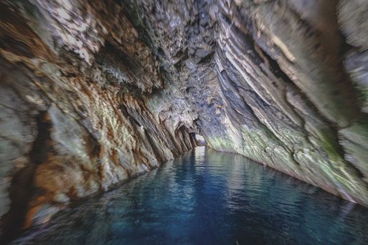 Ocean between cave with dry surface in daytime